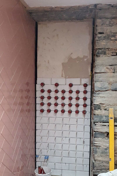 A challenging surface for tiling, looking good with Stratarise tile levellers.